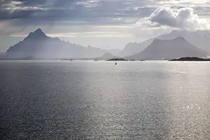 Sunshine over sea and mountain scenery Lofoten islands
