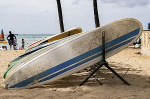 Surfboards in a board rack at Waikiki