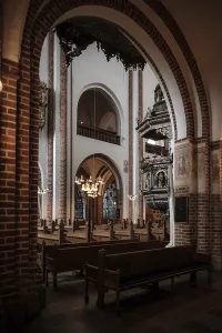 The surrounding grounds and interior of Roskilde Cathedral