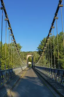 Suspension bridge of Coudes village on river Allier