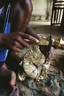Swan shaped pooja lamp being worked at Nachiyarkoil near Thanjavur