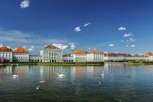 Swans and ducks in artificial pool in front of the Nymphenburg Palace