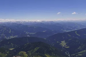 Sweeping views of mountain ranges and snow-capped peaks under a clear sky