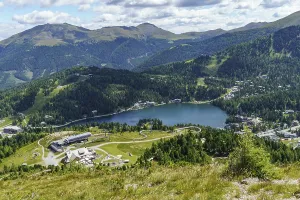Sweeping views over a picturesque lake surrounded by mountains and forests