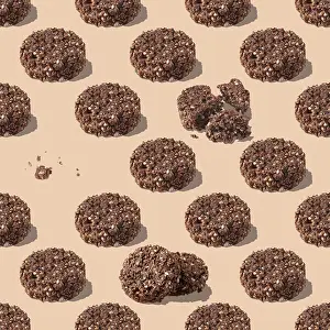 Sweets made of cereals and chocolate on a beige background