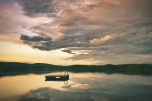 Swimming island in Sweden on a lake at sunset