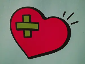 Symbolic image red heart with plaster