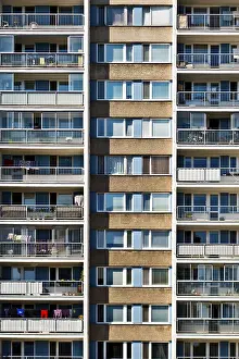 Framed Print : A symmetrical high-rise apartment building with balconies