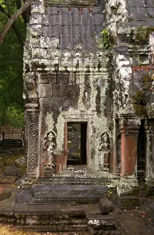 Ta Prohm was built in the Bayon style largely in the late 12th and early 13th centuries