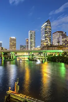 Tampa skyline with skyscrapers and bridge over Hillsborough River at night in downtown Tampa