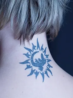 Tattoo on the neck of a blond woman