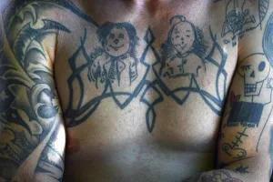 Tattoos, Max and Moritz on the upper body of a young man