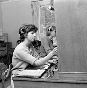 Telephony in the 1960s. Woman working at a telephone switchboard as it's operator