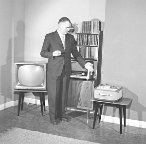 Television in the 1950s. A proud elderly man is pictured in his home with the latest in electronic home equipment