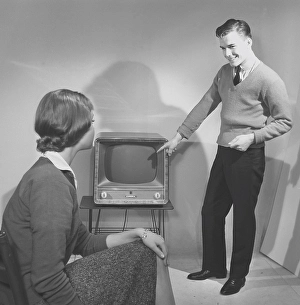 Television in the 1950s. A young couple is pictured with a typical 50s television set. Photo Kristoffersson ref CC94-2. Sweden 1958