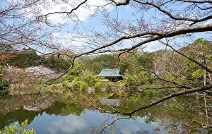 Temple building reflected in Kyoyochi pond in Japanese garden