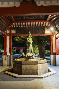 The temple complex is beautifully illuminated against the night sky