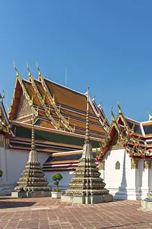 The temple complex Wat Pho with the main building called Prah Ubosot and the small Chedis