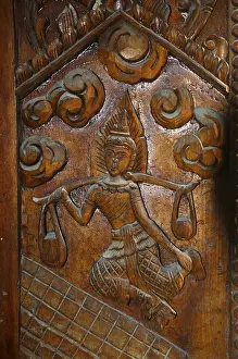Temple door decorated with wood carvings in Buddhist monastery complex Buddhist temple complex Wat Sri Sunthon
