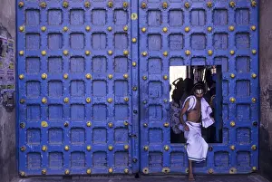 Temple priest crossing the Main door in Varadarajaswamy temple