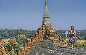 Temple top with tourist and view of many temples