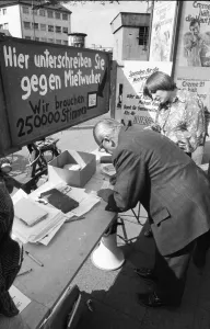 Tenants protest with a collection of signatures