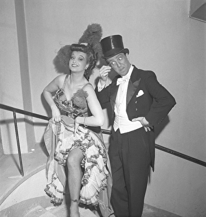 At the theater in 1950. A man and a woman dressed in their stage clothes before a performance backstage