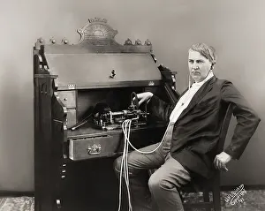 Thomas Alva Edison with his cylinder phonograph
