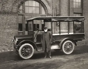 Thomas Alva Edison inspecting a Lansden Electric truck which used Edison batteries