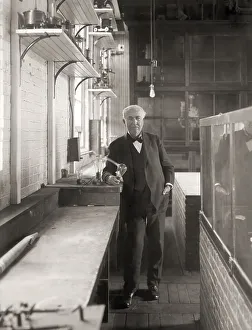 Thomas Alva Edison with his lightbulb
