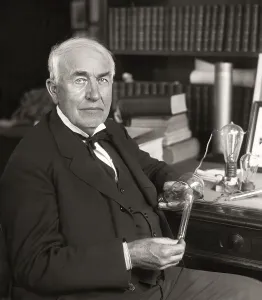 Thomas Alva Edison with his lightbulb