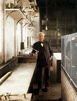 Thomas Alva Edison with his lightbulb