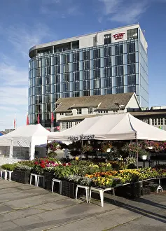 Thon Hotel building and market flower stall