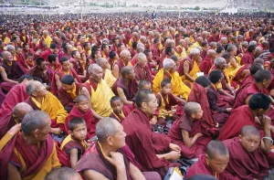 Thousands of Buddhist monks listening to the teachings of the Dalai Lama