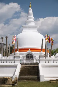 Thuparama Dagoba, decorated with orange bandages and flags