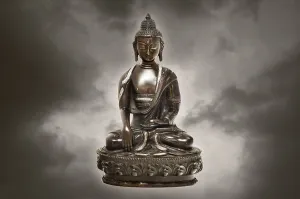 Tibetan Buddha statue made of bronze, with clouds