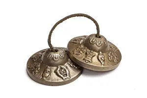 Tibetan Buddhist tingsha cymbals isolated on white