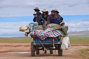 Tibetan pilgrims on a tractor on the road from Gerze to Tsochen