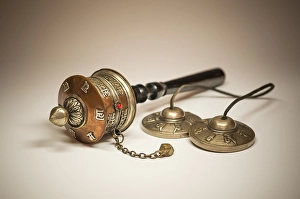 A Tibetan prayer mill and cymbals