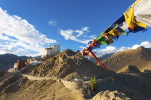 Tibetan prayer flags lead to Tsemo Fort