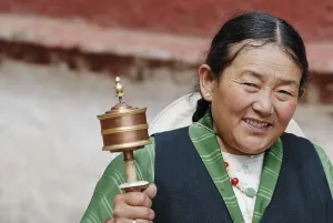 Tibetan woman with prayer wheel