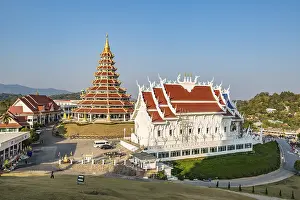 Nine tiered pagoda and viharn assembly hall at Wat Huay Pla Kang in Chiang Rai