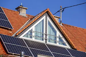Tiled roof with dormer and photovoltaic system