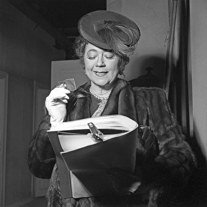 Tollie Zellman 1942. Swedish actress (1887-1967) She is reading something and to see the small details better she uses a lorgnette, a type of monocle lens attached to a chain around her neck