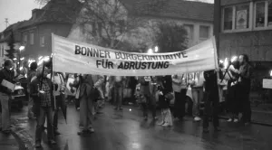 A torchlight procession for disarmament and against nuclear missiles moved to the Ministry of Defence at Hardthoehe