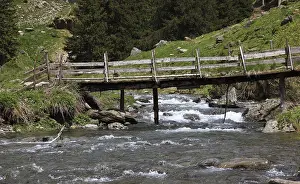 Torrent and old wooden bridge on the Transfogarasan High Road