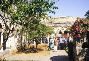 Tourist group exploring the cloister of the San Giovanni Hermitage, San Giovanni degli Eremiti, Palermo, Sicily, Italy, 1999, Europe