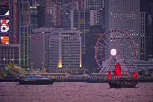 Tourist junk boat ferry with red sails