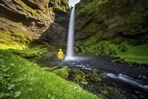 Tourist at Kvernufoss waterfall
