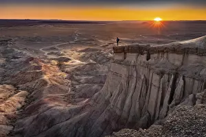 Tourist standing on rock formation Tsagaan Suvarga